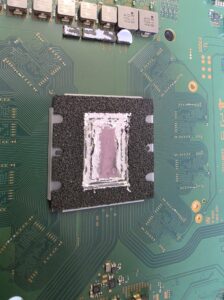 PS5 processor with patchy liquid-metal coverage before servicing