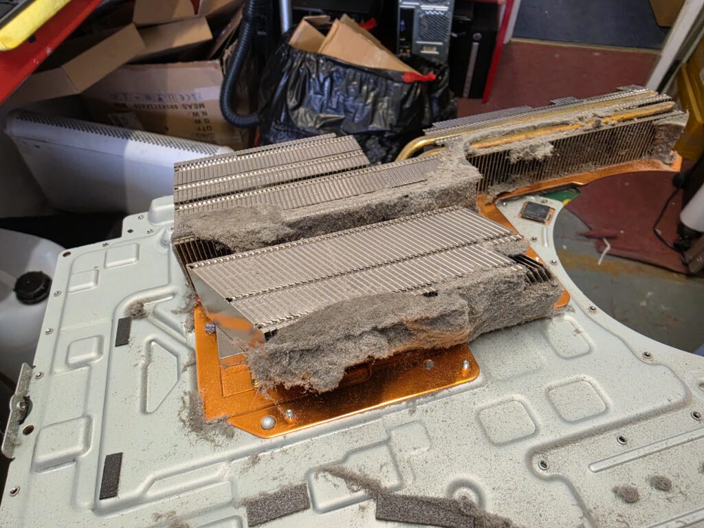 PS5 heatsink fins blocked by thick dust before cleaning
